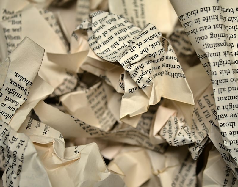Hiring a Book Editor vs Self Editing A Look at the Pros and Cons crumbled paper