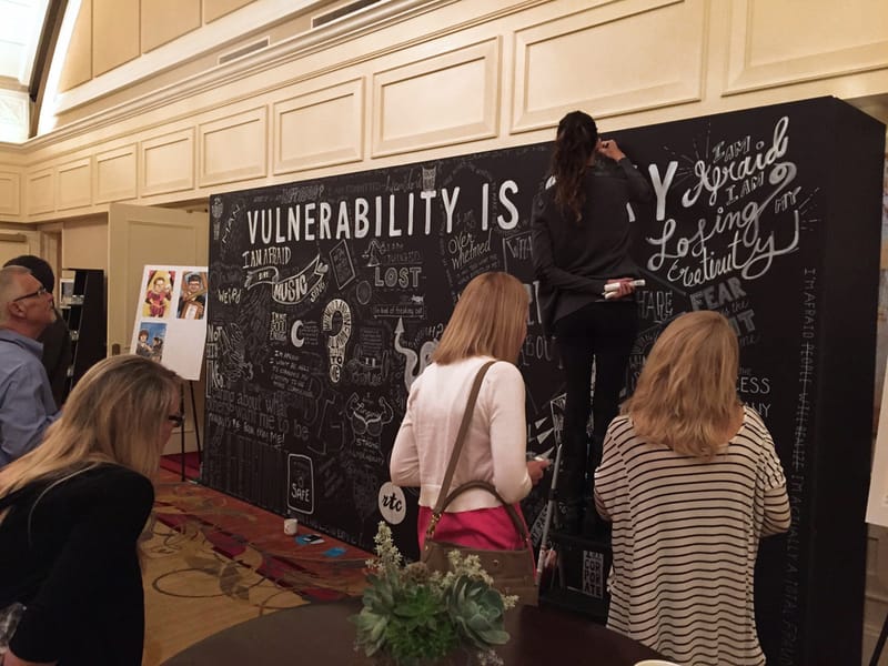 Group looking at vulnerability wall