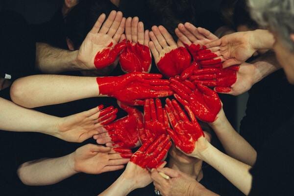 Hands with painted red heart